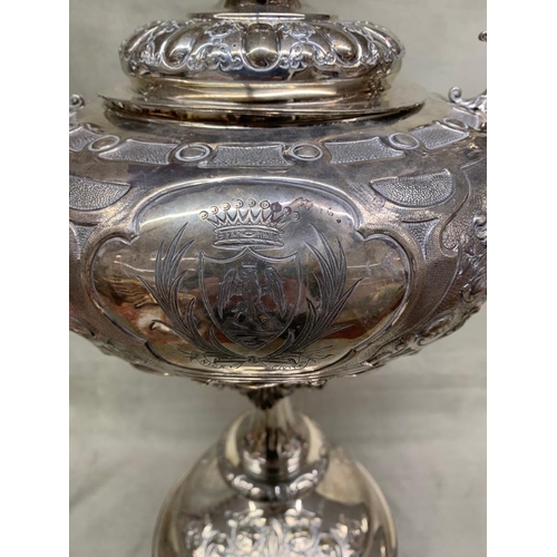 195 - An exceptional antique golfing trophy.  
  
 The Trophy made by Mappin and Webb is sold silver and w... 