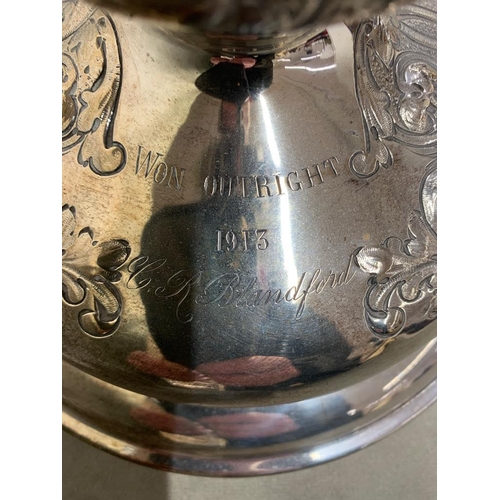 195 - An exceptional antique golfing trophy.  
  
 The Trophy made by Mappin and Webb is sold silver and w... 