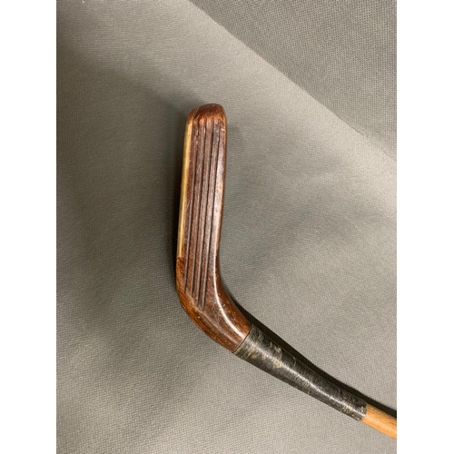 201 - Antique Willie Park Scare Head putter with 5 inch face, with hickory shaft and suede grip, 35 inches... 