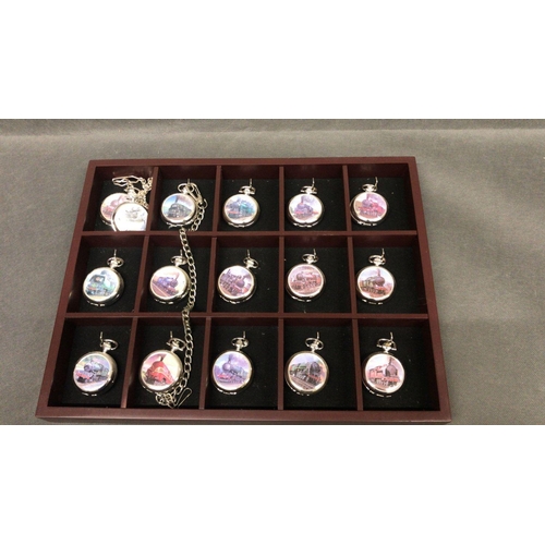 213 - A collection of 31 pocket watches with Steam locomotive images on front of cases in 2 display boxesd