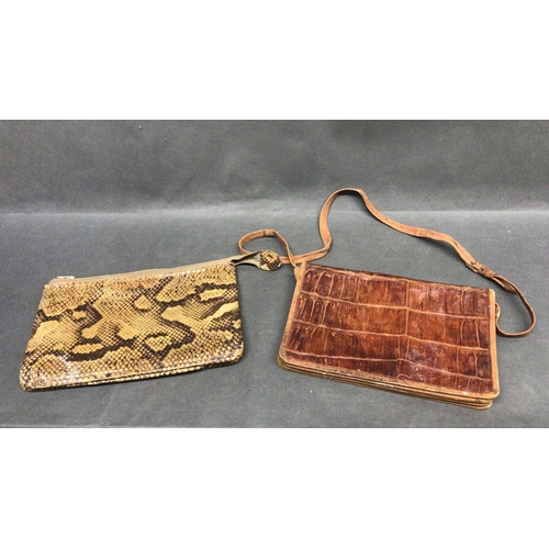 214 - A vintage crocodile skin hand bag with strap and a snakeskin clutch bag with zip fastener