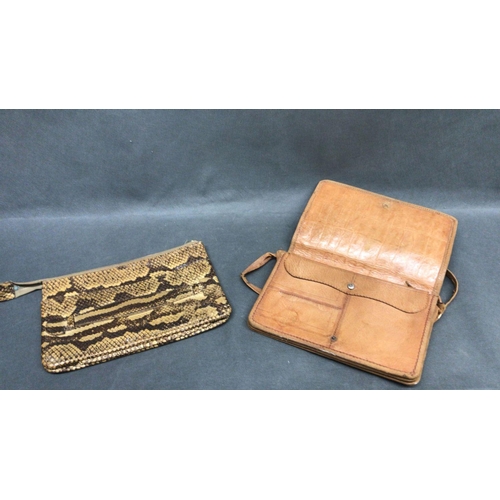 214 - A vintage crocodile skin hand bag with strap and a snakeskin clutch bag with zip fastener