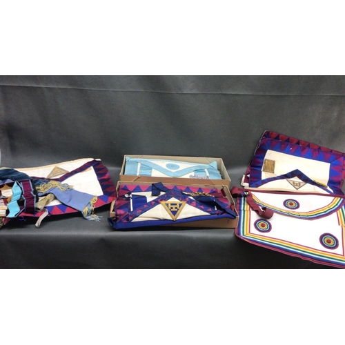 215 - Masonic regalia, 5 different sets of various aprons and jewels.