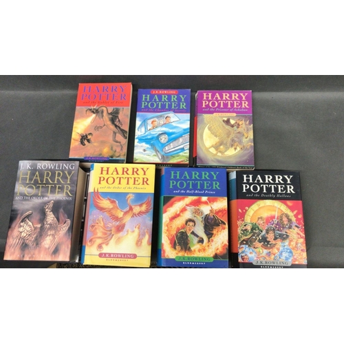 221 - A collection of seven Harry Potter books  
  
 
 Adult edition of The Order of The Phoenix, Hard bac... 