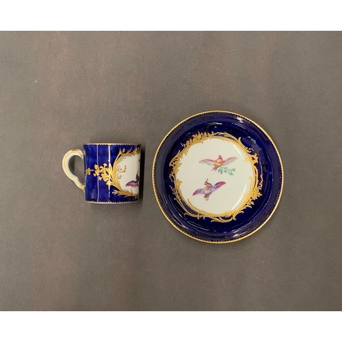 224 - A Sevres blue and gold bird design cup and saucer, date marks A and E, circa 1755-6, in beau blue? (... 