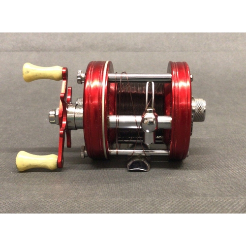 28 - ABU Ambassadeur 5000 multiflex fishing reels finished in scarlet with twin agate handles, early 4 sc... 