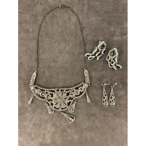 12 - An antique white metal necklace along with two pairs of white metal earrings