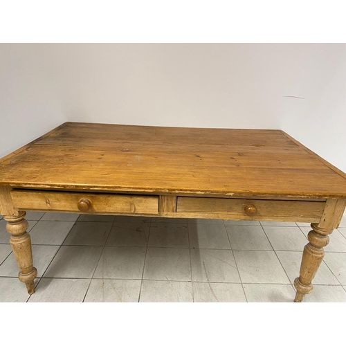 128 - A large antique pine farmhouse table 
  
 177cm x 116cm  
 Height 74cm