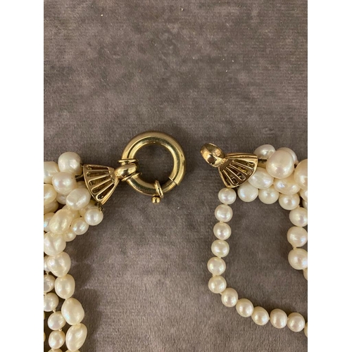 13 - A large antique 6 strand pearl necklace joined with a large 9ct gold clasp £1000-£1500