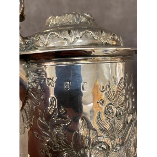 48 - A early solid silver tankard possibly 1719 with later embellishments