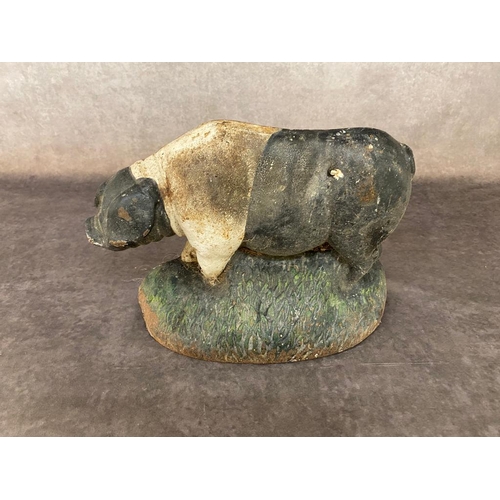 56 - An antique cast iron pig doorstop 29 cm long