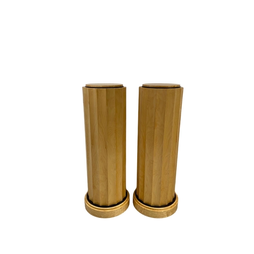 101 - A pair of large Art Deco style satin wood plinths 112cm high x 35cm diameter