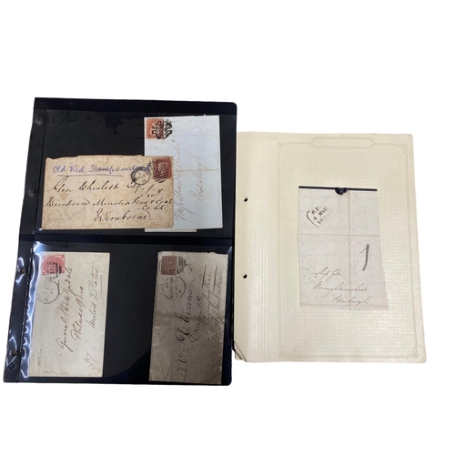 28 - Great Britain postal history. A small mixed collection, with some items on old album pages and other... 