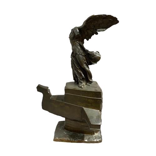 52 - A large 19th Century bronze model of the winged Victory (Nike) of Samothrace, the winged figure rais... 