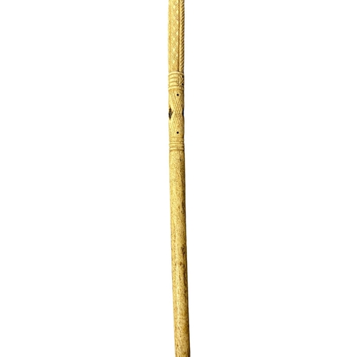 85 - An antique whale bone and Baleen Scrimshaw walking stick with carved horse head handle and intricate... 