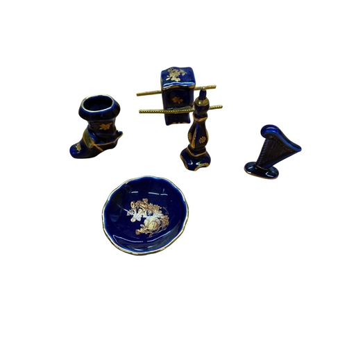 96 - A collection of 27 pieces of cobalt and gold Limoges porcelain