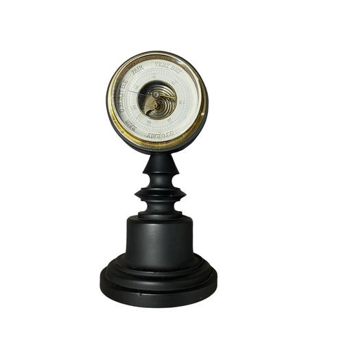 12 - An antique barometer turned from black marble 26 cm height.