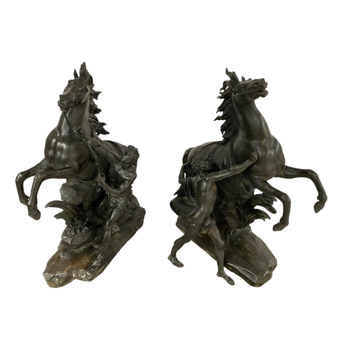 46 - A large pair of bronze Marly style horses, 63cm high