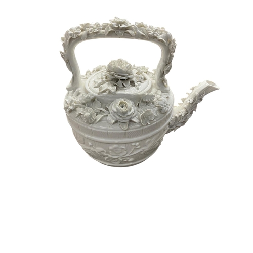 58 - An intricately made white teapot decorated with finely detailed roses and foliage. Some hairline cra... 