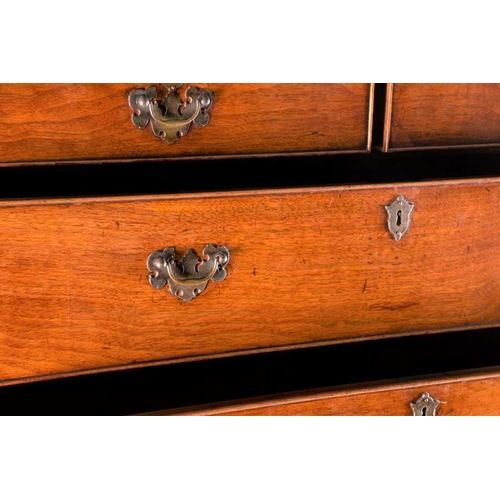 121 - A fine George III oak chest on chest with canted front corners two short over three graduated drawer... 