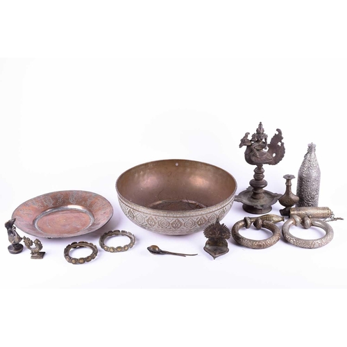 214 - A Tibetan cast bronze oil lamp, hentha weights, a leaf shape oil lamp, an Indian brass bowl, a Tibet... 