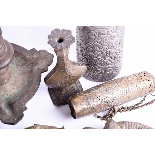 214 - A Tibetan cast bronze oil lamp, hentha weights, a leaf shape oil lamp, an Indian brass bowl, a Tibet... 