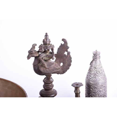 214 - A Tibetan cast bronze oil lamp, hentha weights, a leaf shape oil lamp, an Indian brass bowl, a Tibet... 