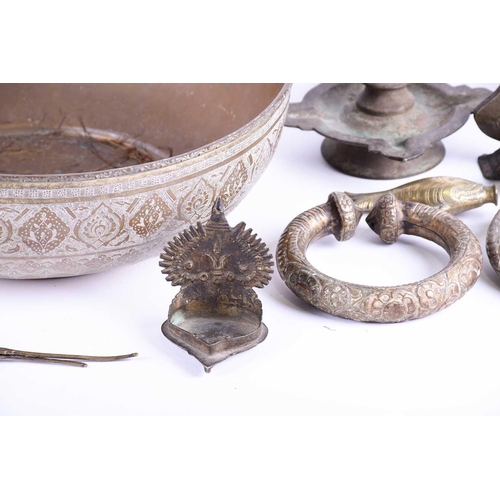 214 - A Tibetan cast bronze oil lamp, hentha weights, a leaf shape oil lamp, an Indian brass bowl, a Tibet... 