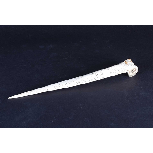 80 - A Cassowary bone dagger, East Sepik River Province, Papua New Guinea, with incised bands of stylised... 