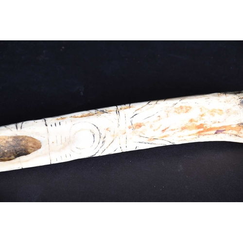 80 - A Cassowary bone dagger, East Sepik River Province, Papua New Guinea, with incised bands of stylised... 