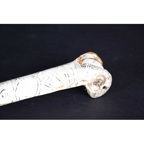 80 - A Cassowary bone dagger, East Sepik River Province, Papua New Guinea, with incised bands of stylised... 