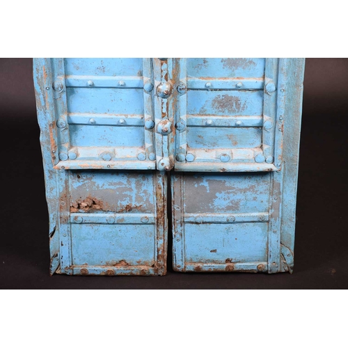 75 - A pair of North African painted wood window shutters, of rectangular form with applied arched decora... 