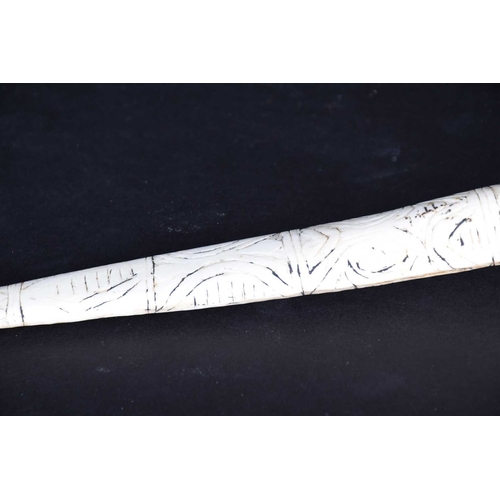 80 - A Cassowary bone dagger, East Sepik River Province, Papua New Guinea, with incised bands of stylised... 