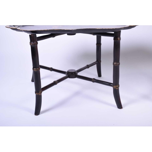 102 - An Edwardian inlaid bijouterie table, of oval form, on slender square legs, splaying at the foot, to... 