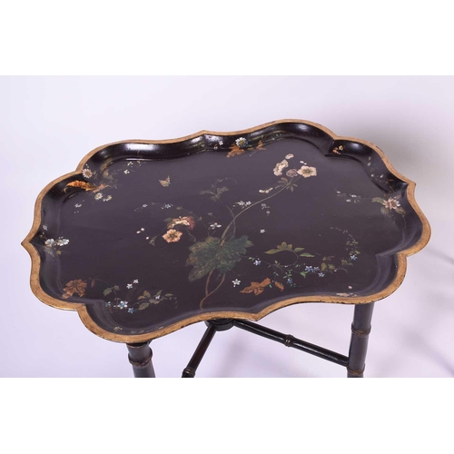 102 - An Edwardian inlaid bijouterie table, of oval form, on slender square legs, splaying at the foot, to... 