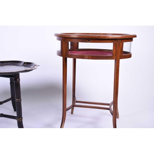 102 - An Edwardian inlaid bijouterie table, of oval form, on slender square legs, splaying at the foot, to... 