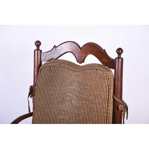 103 - A Spanish walnut ladderback armchair, early 20th century, with ball finials and shaped back splats, ... 