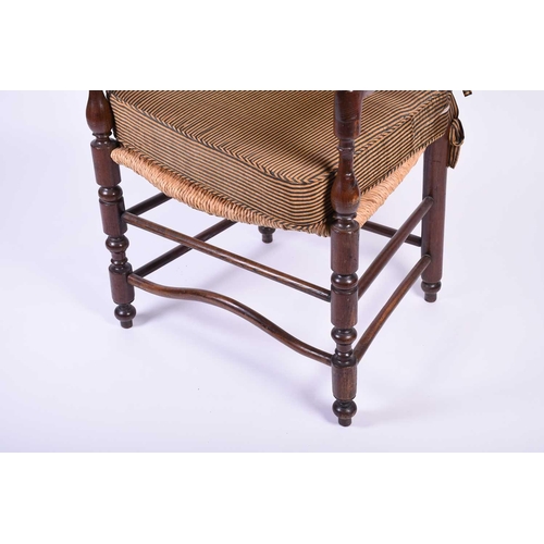 103 - A Spanish walnut ladderback armchair, early 20th century, with ball finials and shaped back splats, ... 