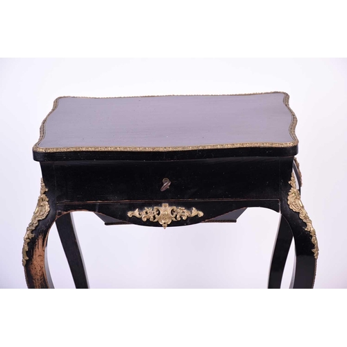 104 - French 19th century ebonised and ormolu mounted dressing table, the interior of the lid with mirror ... 