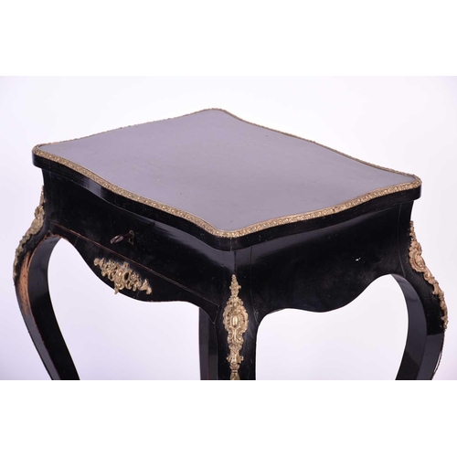 104 - French 19th century ebonised and ormolu mounted dressing table, the interior of the lid with mirror ... 