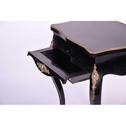 104 - French 19th century ebonised and ormolu mounted dressing table, the interior of the lid with mirror ... 