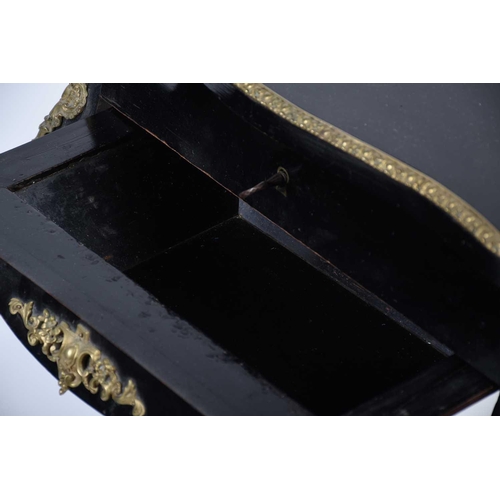 104 - French 19th century ebonised and ormolu mounted dressing table, the interior of the lid with mirror ... 