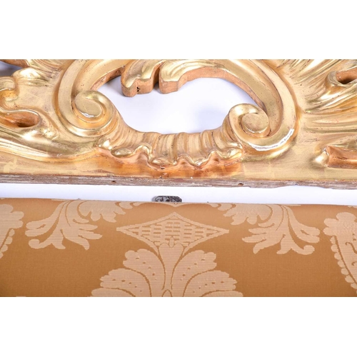 107 - A 20th century carved giltwood cushion-back headboard, with acanthus scroll surmount and corners, 21... 