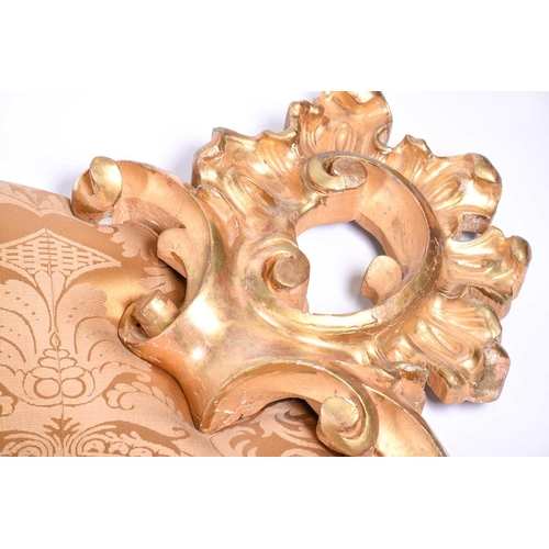 107 - A 20th century carved giltwood cushion-back headboard, with acanthus scroll surmount and corners, 21... 