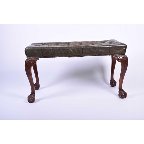 110 - A Geo III style mahogany duet stool, 20th century, with green leather buttoned seat, on four cabriol... 