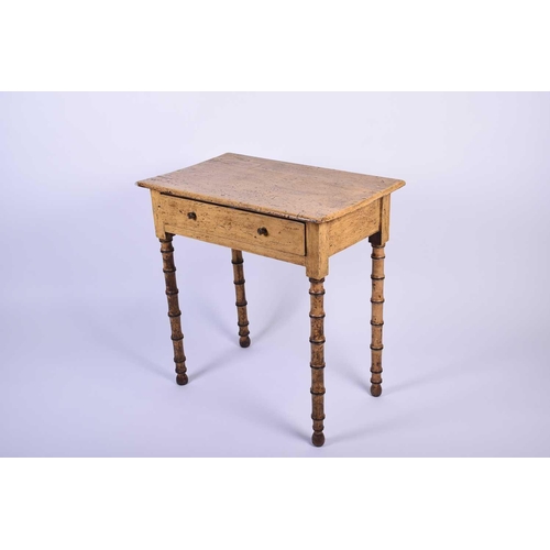 111 - A Geo IV side table, the rectangular top above a single drawer, supported on four simulated bamboo l... 