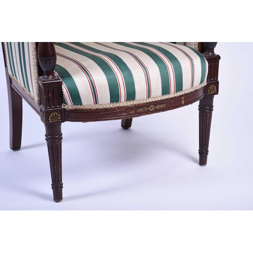 112 - A French Empire style armchair, the mahogany frame with gilt metal embellishments, upholstered in a ... 