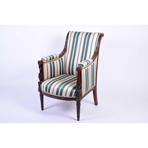 112 - A French Empire style armchair, the mahogany frame with gilt metal embellishments, upholstered in a ... 