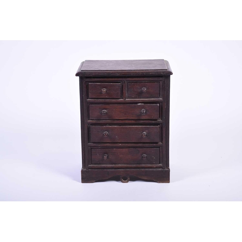 114 - A 19th century apprentice piece oak chest, the top with moulded edge above two short and three long ... 