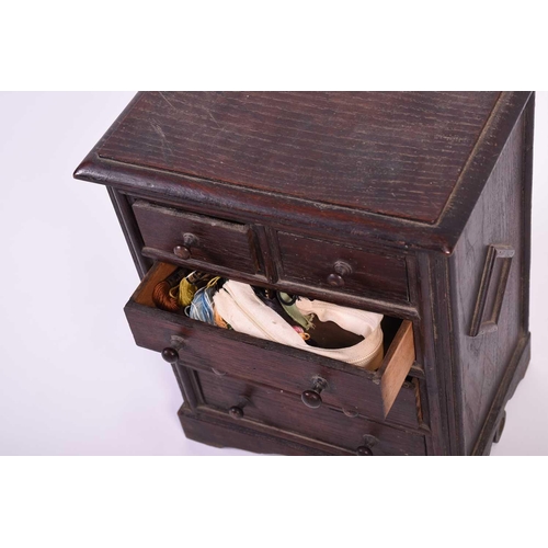 114 - A 19th century apprentice piece oak chest, the top with moulded edge above two short and three long ... 